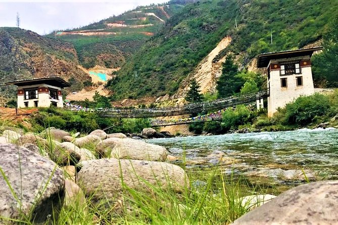 Bhutan Trip - Thimphu temples: Tachogang Lhakhang views, Memorial Chorten, and Tashichho Dzong at dusk