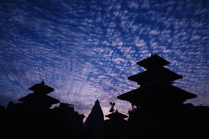 Kathmandu Sunset Tour by Rickshaw Including Durbar Square Visit - Walking into Kathmandu Durbar Square: temples, palaces, and nighttime details